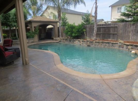 a picture of a concrete pool deck in manteca, ca